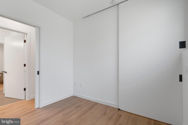 57 N St NW Unit 134, Washington, DC 20001 - unfurnished room featuring light wood-style floors and baseboards