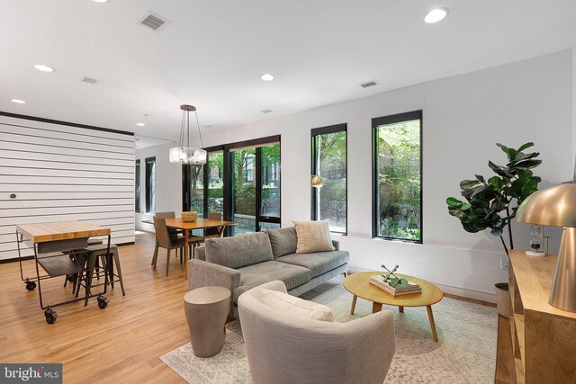 57 N St NW Unit 134, Washington, DC 20001 - living area with light wood-type flooring, recessed lighting, and a chandelier