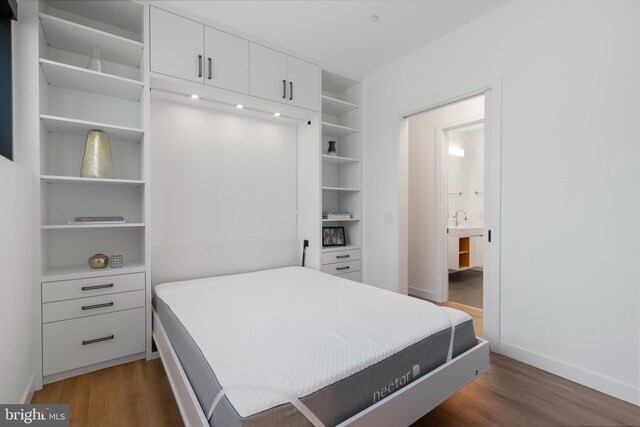 57 N St NW Unit 134, Washington, DC 20001 - bedroom with wood finished floors and baseboards