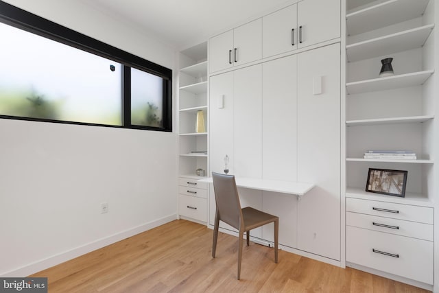 57 N St NW Unit 134, Washington, DC 20001 - unfurnished office with light wood finished floors, built in study area, and baseboards