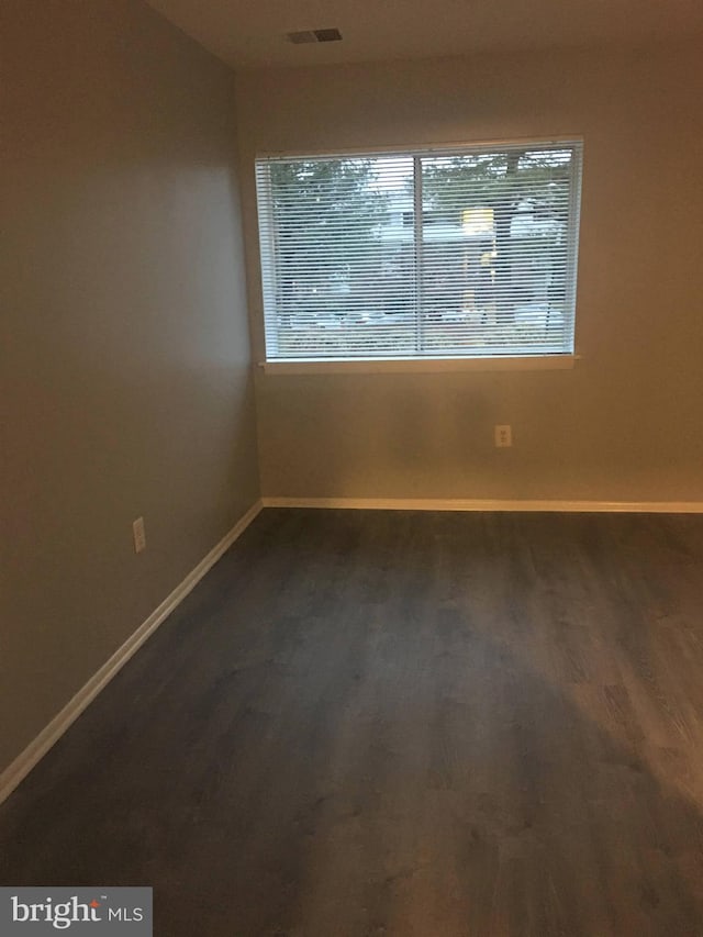 10241 Prince Pl Unit 27-T3, Upper Marlboro, MD 20774 - unfurnished room with baseboards and dark wood-style floors
