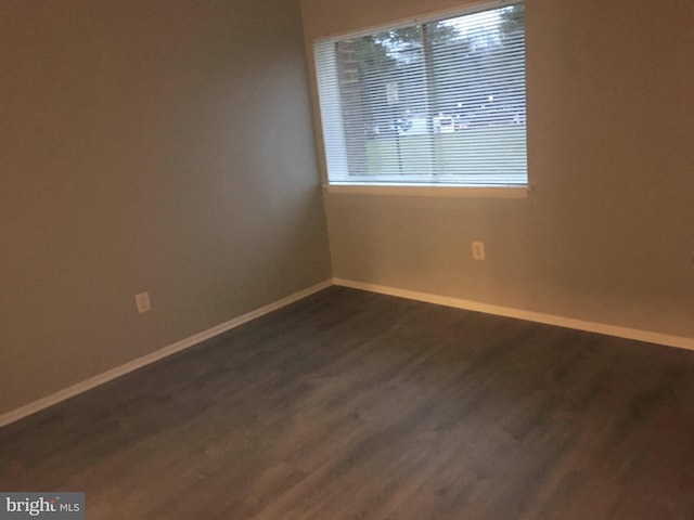 10241 Prince Pl Unit 27-T3, Upper Marlboro, MD 20774 - spare room featuring baseboards and dark wood-style floors