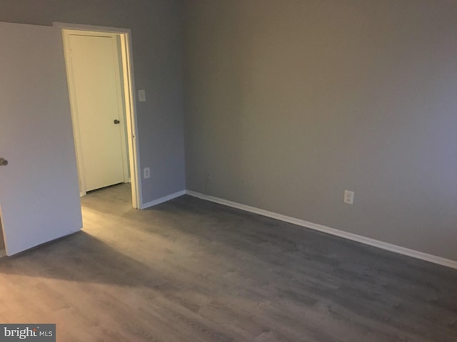 10241 Prince Pl Unit 27-T3, Upper Marlboro, MD 20774 - empty room with dark wood finished floors and baseboards