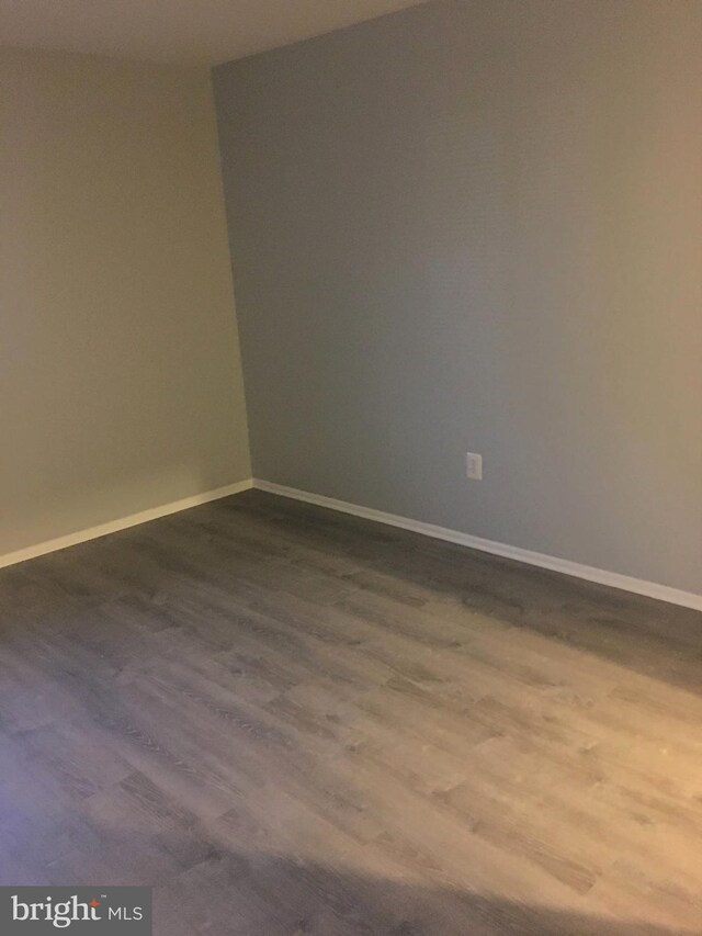 10241 Prince Pl Unit 27-T3, Upper Marlboro, MD 20774 - spare room featuring dark wood finished floors and baseboards