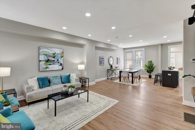 771 N Grantley St, Baltimore, MD 21229 - living room featuring recessed lighting, wood finished floors, and baseboards
