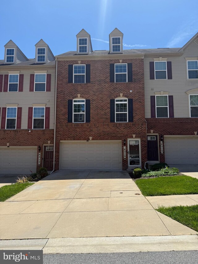 6315 Halsted Ave, Capitol Heights, MD 20743 - view of property featuring driveway, an attached garage, and brick siding