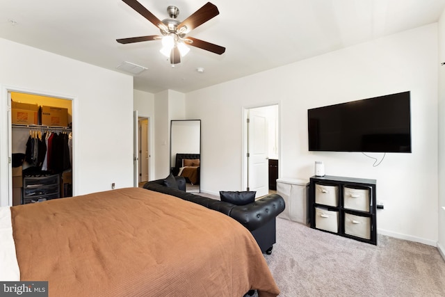 6315 Halsted Ave, Capitol Heights, MD 20743 - carpeted bedroom featuring a spacious closet, a closet, baseboards, and a ceiling fan