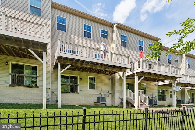 6315 Halsted Ave, Capitol Heights, MD 20743 - rear view of house with central air condition unit and a wooden deck