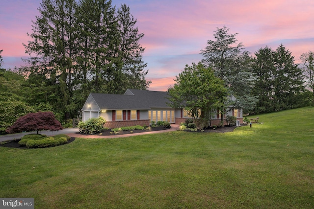10 Old Orchard Ln, Chadds Ford, PA 19317 - view of front facade featuring a front yard, an attached garage, and brick siding