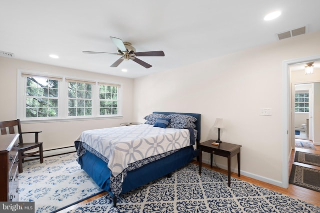 10 Old Orchard Ln, Chadds Ford, PA 19317 - bedroom featuring wood finished floors, baseboards, recessed lighting, a baseboard radiator, and ceiling fan