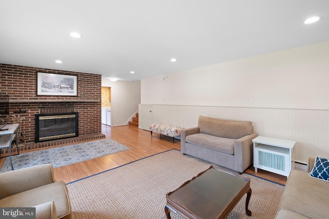 10 Old Orchard Ln, Chadds Ford, PA 19317 - living room featuring stairway, wood finished floors, a wainscoted wall, baseboard heating, and a fireplace