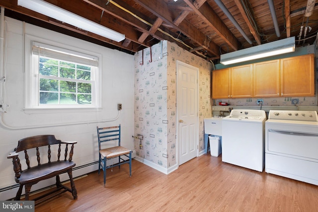 10 Old Orchard Ln, Chadds Ford, PA 19317 - laundry area featuring cabinet space, washer and clothes dryer, light wood finished floors, and a baseboard heating unit