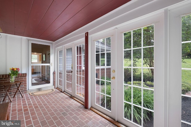 10 Old Orchard Ln, Chadds Ford, PA 19317 - unfurnished sunroom featuring french doors, brick floors, wooden ceiling, and healthy amount of natural light