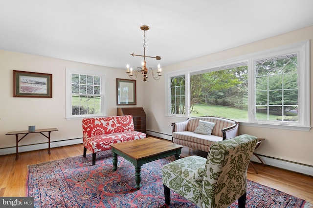10 Old Orchard Ln, Chadds Ford, PA 19317 - sitting room with a baseboard heating unit, a chandelier, and wood finished floors
