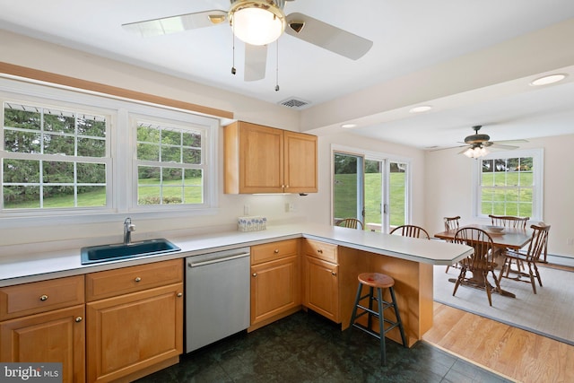 10 Old Orchard Ln, Chadds Ford, PA 19317 - kitchen with stainless steel dishwasher, a sink, ceiling fan, a kitchen bar, and plenty of natural light