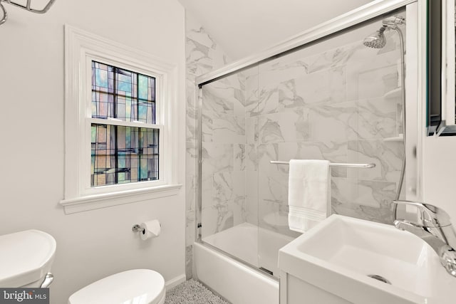 1861 S George Mason Dr, Arlington, VA 22204 - full bath featuring a sink, toilet, shower / bath combination with glass door, and baseboards