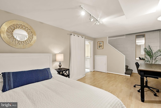 1861 S George Mason Dr, Arlington, VA 22204 - bedroom with track lighting, wood finished floors, baseboards, and ensuite bath