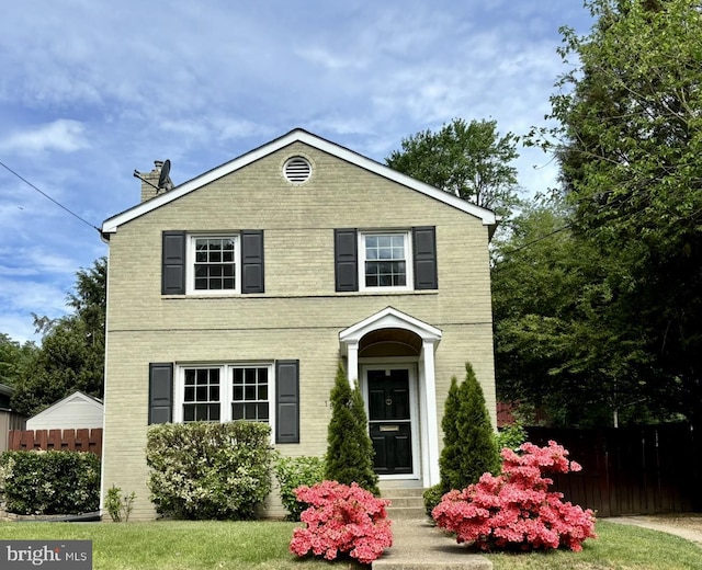 1861 S George Mason Dr, Arlington, VA 22204 - traditional-style home with brick siding and a chimney