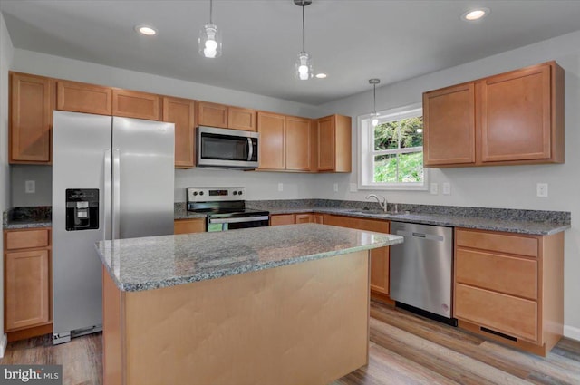 12366 Benning Ave, Waynesboro, PA 17268 - kitchen featuring appliances with stainless steel finishes, recessed lighting, light wood-type flooring, a kitchen island, and dark stone counters
