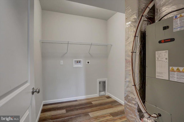12366 Benning Ave, Waynesboro, PA 17268 - washroom featuring hookup for an electric dryer, wood finished floors, heating unit, baseboards, and hookup for a washing machine