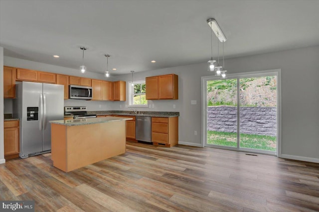 12366 Benning Ave, Waynesboro, PA 17268 - kitchen with appliances with stainless steel finishes, light wood finished floors, recessed lighting, a sink, and hanging light fixtures