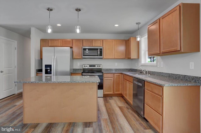 12366 Benning Ave, Waynesboro, PA 17268 - kitchen with stainless steel appliances, a sink, wood finished floors, recessed lighting, and stone counters