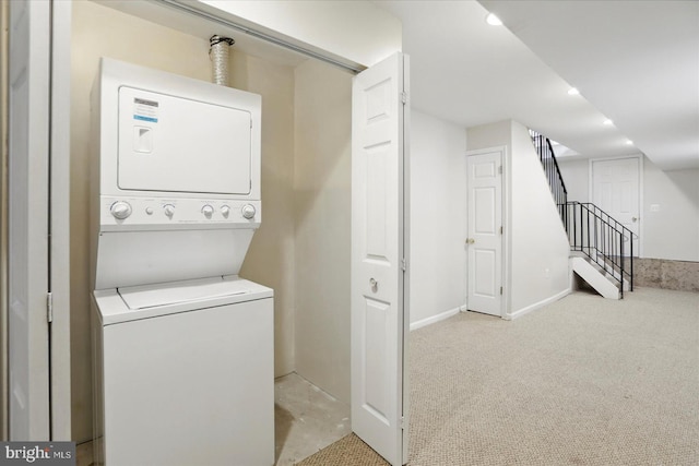 1225 W Cross St, Baltimore, MD 21230 - laundry area featuring stacked washer / drying machine, carpet, and baseboards