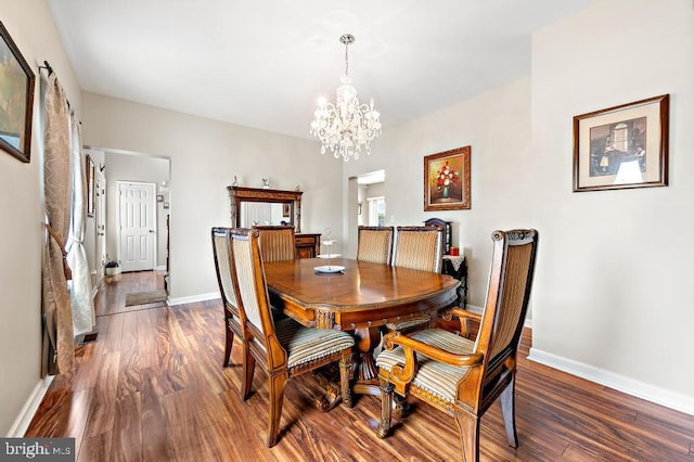 128 E Delaware Dr, Little Egg Harbor Twp, NJ 08087 - dining room with wood finished floors, a chandelier, and baseboards