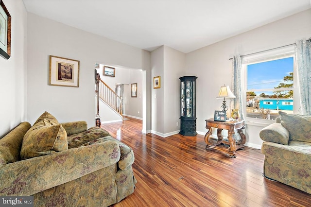128 E Delaware Dr, Little Egg Harbor Twp, NJ 08087 - living area featuring wood finished floors, stairway, and baseboards
