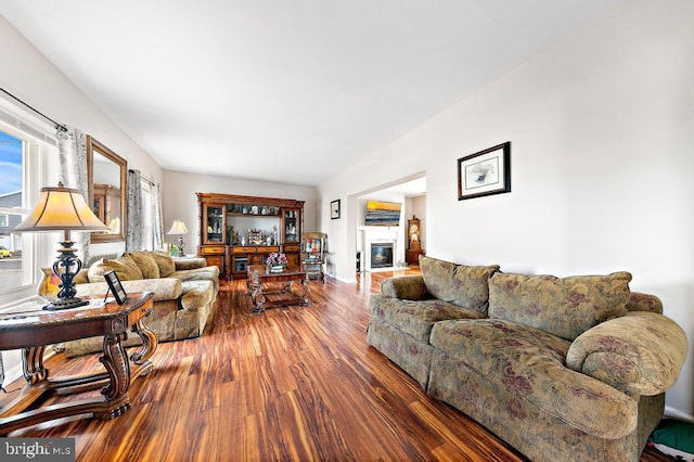 128 E Delaware Dr, Little Egg Harbor Twp, NJ 08087 - living area with wood finished floors, a glass covered fireplace, and baseboards