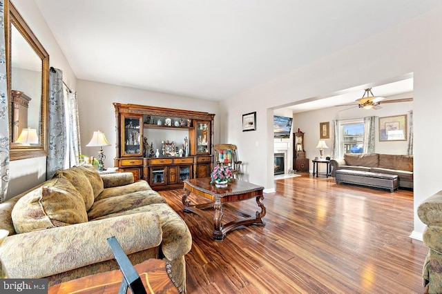128 E Delaware Dr, Little Egg Harbor Twp, NJ 08087 - living room featuring wood finished floors, a fireplace with flush hearth, and ceiling fan