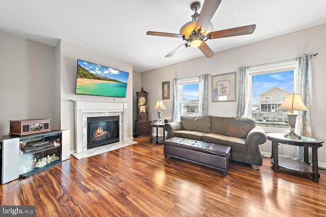 128 E Delaware Dr, Little Egg Harbor Twp, NJ 08087 - living room featuring wood finished floors, a premium fireplace, and ceiling fan