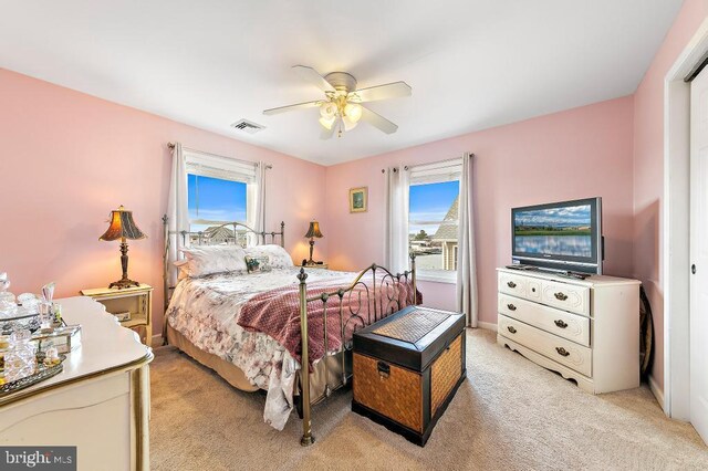 128 E Delaware Dr, Little Egg Harbor Twp, NJ 08087 - bedroom with light colored carpet and ceiling fan
