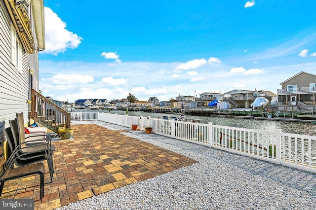 128 E Delaware Dr, Little Egg Harbor Twp, NJ 08087 - fenced backyard with a residential view, a water view, and a patio area