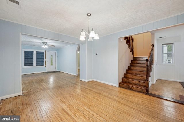 4311 Quinn St, Capitol Heights, MD 20743 - unfurnished living room with hardwood / wood-style floors, stairway, and baseboards
