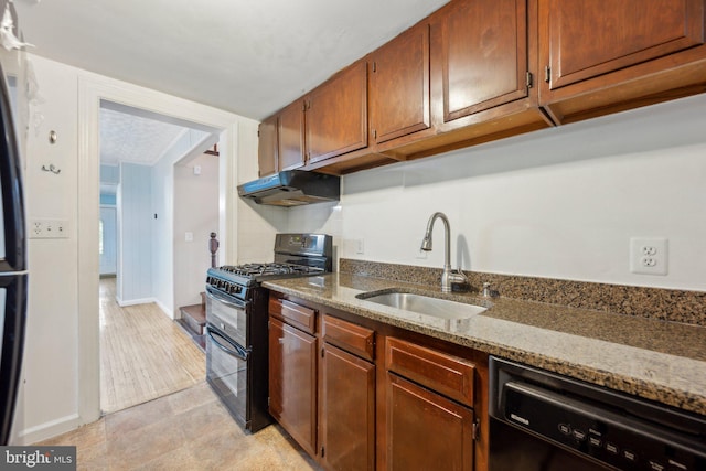 4311 Quinn St, Capitol Heights, MD 20743 - kitchen with black appliances, a sink, under cabinet range hood, stone counters, and brown cabinets