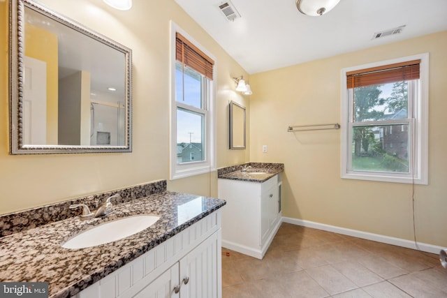 4311 Quinn St, Capitol Heights, MD 20743 - bathroom featuring plenty of natural light, baseboards, two vanities, and tile patterned floors