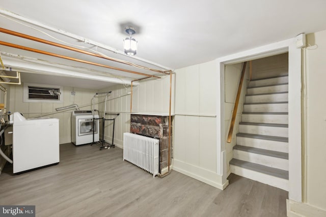 4311 Quinn St, Capitol Heights, MD 20743 - finished below grade area with washing machine and dryer, wood finished floors, stairway, and radiator