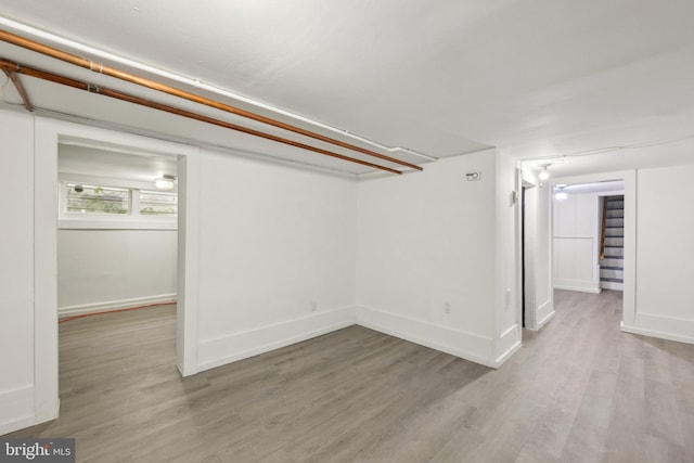 4311 Quinn St, Capitol Heights, MD 20743 - basement featuring wood finished floors, stairway, and baseboards