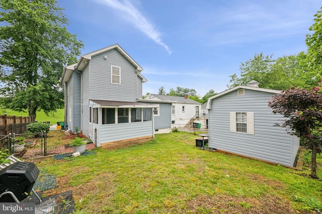 4311 Quinn St, Capitol Heights, MD 20743 - rear view of property with an outbuilding and a sunroom