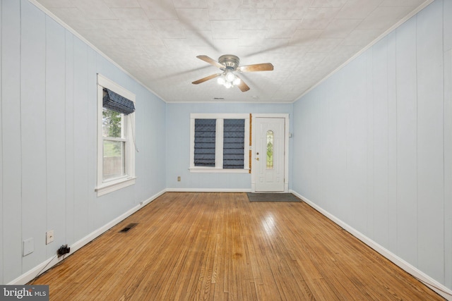4311 Quinn St, Capitol Heights, MD 20743 - spare room with wood finished floors, crown molding, a ceiling fan, and baseboards