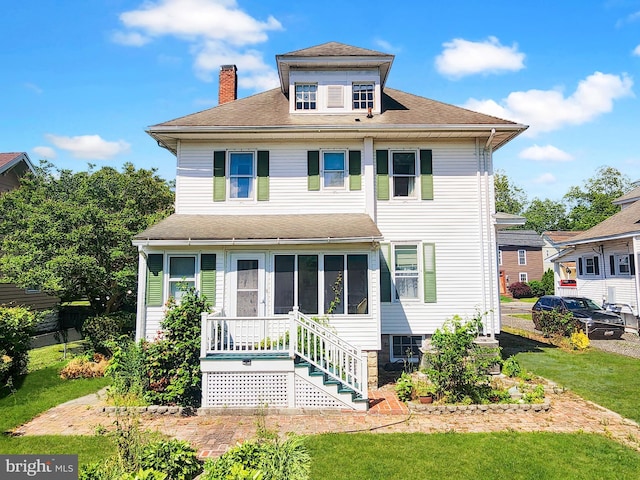 604 Market St, Pocomoke City, MD 21851 - american foursquare style home with a chimney, a front yard, and roof with shingles