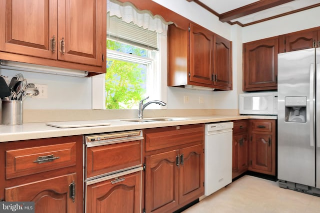 604 Market St, Pocomoke City, MD 21851 - kitchen with white appliances, a sink, light countertops, and light floors