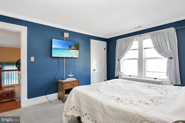 604 Market St, Pocomoke City, MD 21851 - bedroom with radiator, carpet, crown molding, and baseboards