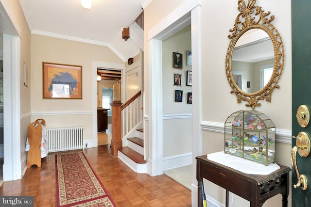 604 Market St, Pocomoke City, MD 21851 - hall featuring radiator heating unit, stairs, vaulted ceiling, and baseboards