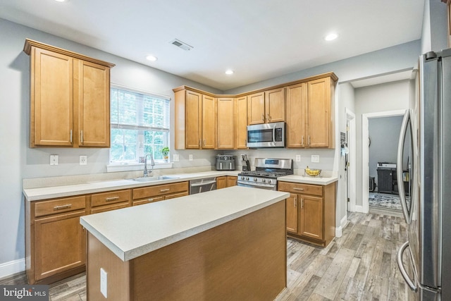 19 Hickory Ridge Ct, Mullica Hill, NJ 08062 - kitchen featuring stainless steel appliances, a sink, light wood-style flooring, light countertops, and recessed lighting