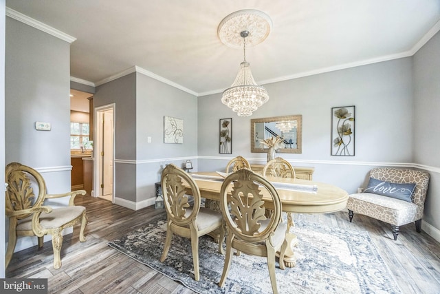 19 Hickory Ridge Ct, Mullica Hill, NJ 08062 - dining area featuring a chandelier, wood finished floors, ornamental molding, and baseboards