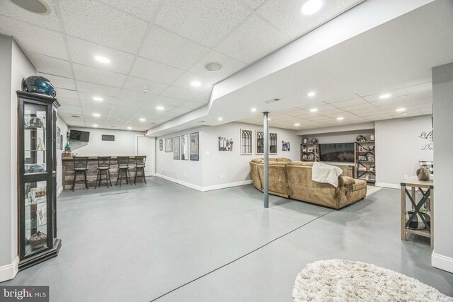19 Hickory Ridge Ct, Mullica Hill, NJ 08062 - living room with baseboards, finished concrete flooring, a drop ceiling, bar area, and recessed lighting