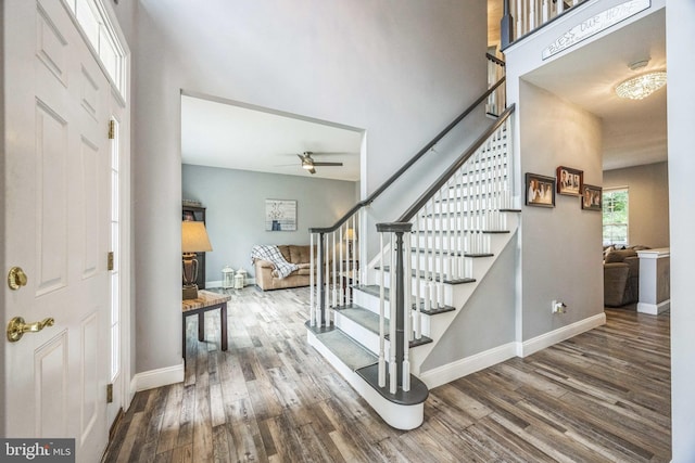 19 Hickory Ridge Ct, Mullica Hill, NJ 08062 - foyer entrance featuring stairway, wood finished floors, a ceiling fan, a high ceiling, and baseboards