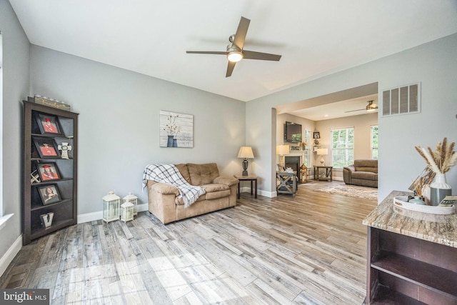 19 Hickory Ridge Ct, Mullica Hill, NJ 08062 - living room with ceiling fan, light wood-style flooring, and a fireplace